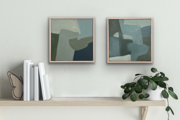 2 12"x12" paintings hung above a shelf